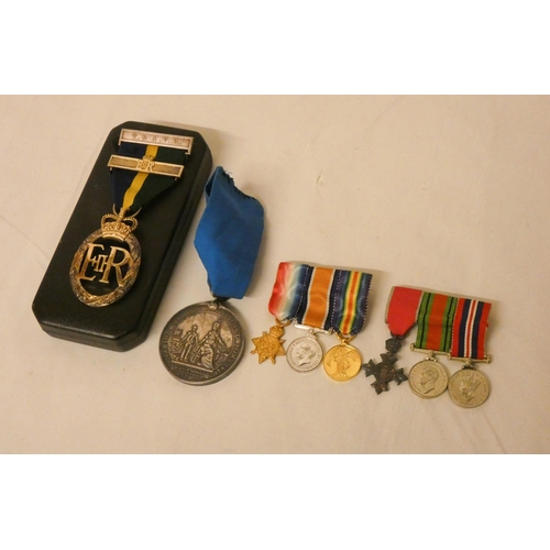 259 - Two groups of miniature medals and silver medal, to The Marine Society and Elizabeth II territorial ... 