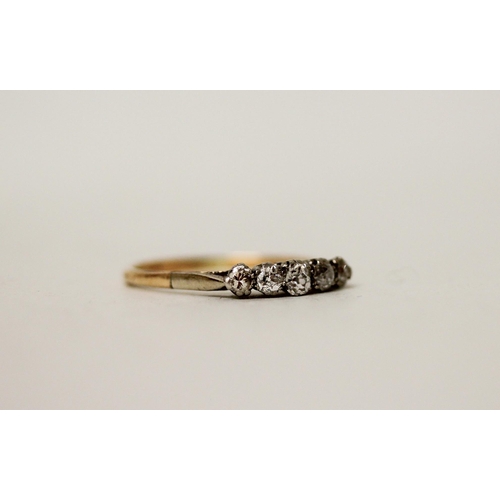 655 - A vintage five stone diamond ring set in unmarked platinum and gold mount. Ring size S. Gross weight... 