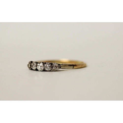 655 - A vintage five stone diamond ring set in unmarked platinum and gold mount. Ring size S. Gross weight... 