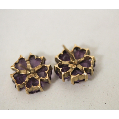 656 - A pair of 9ct yellow gold amethyst and diamond flower cluster ear studs