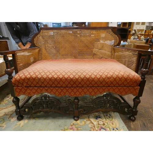 334 - A mahogany framed Bergere style two seater settee with upholstered seat