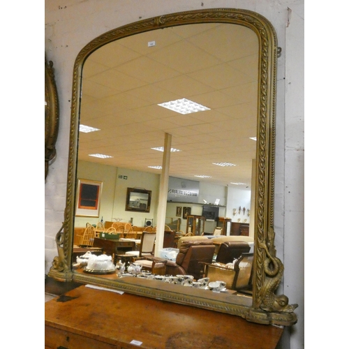 446 - A Victorian gilt framed over mantel mirror with domed top. 4' wide x 4'6