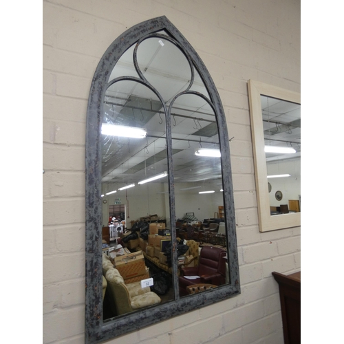 25 - A gothic style indoor/ outdoor wall mirror in grey metal frame