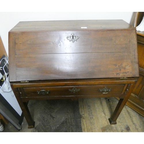 51 - An antique mahogany bureau fitted one long drawer on square legs, 34