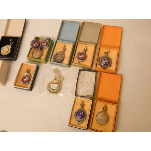 278 - A large collection of sporting medallions and medals, to include ten silver examples