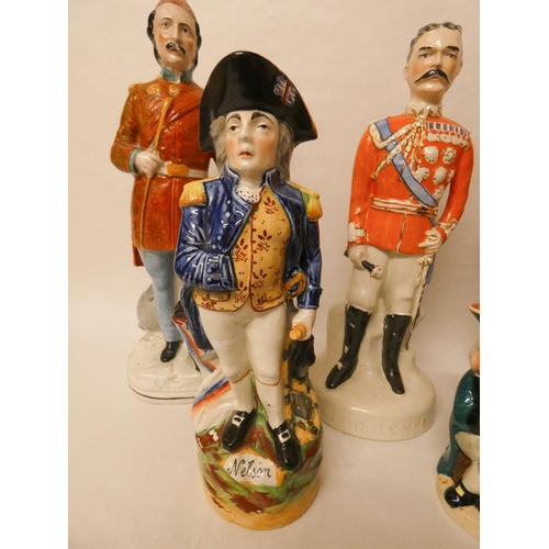 265 - A collection of Staffordshire flatback figures and jugs to include Nelson, Kitchener etc