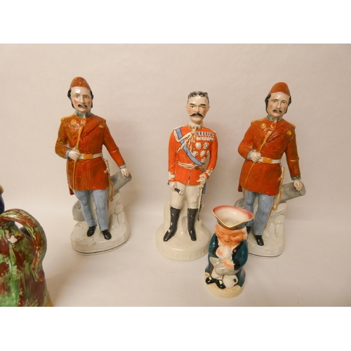 265 - A collection of Staffordshire flatback figures and jugs to include Nelson, Kitchener etc