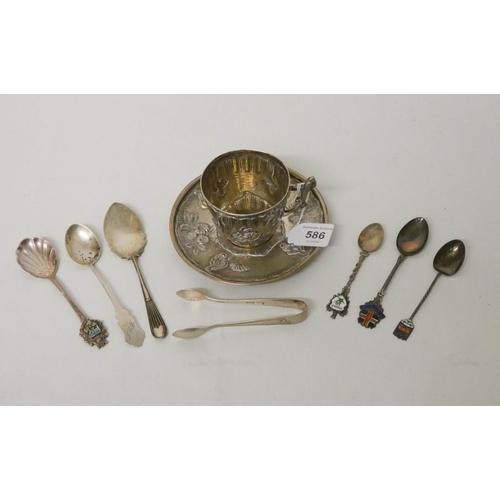 586 - A collection of silver teaspoons, nips and a Chinese white metal tea cup and saucer, gross weight 7 ... 