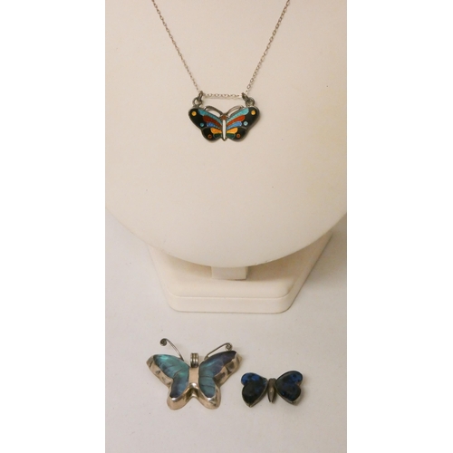 588 - A collection of butterfly shaped jewellery to include an enamelled pendant necklace