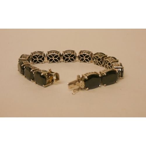 589 - A modern silver and black stone panel bracelet, 21 cms long