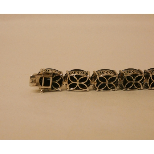 589 - A modern silver and black stone panel bracelet, 21 cms long