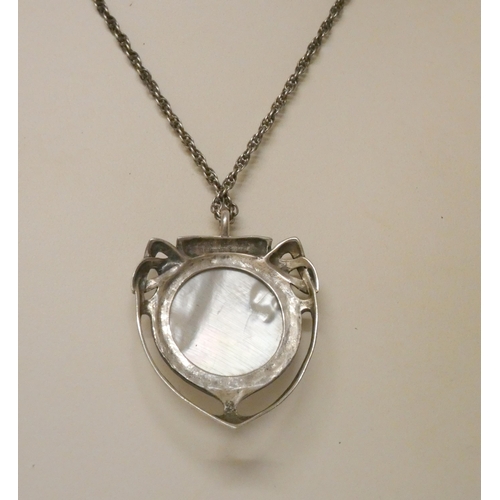 593 - An Art Nouveau silver and mother of pearl pendant on silver chain