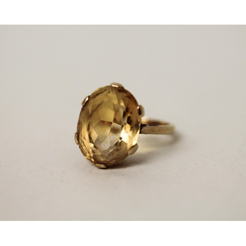 595 - A 9ct gold citrine set dress ring, ring size M