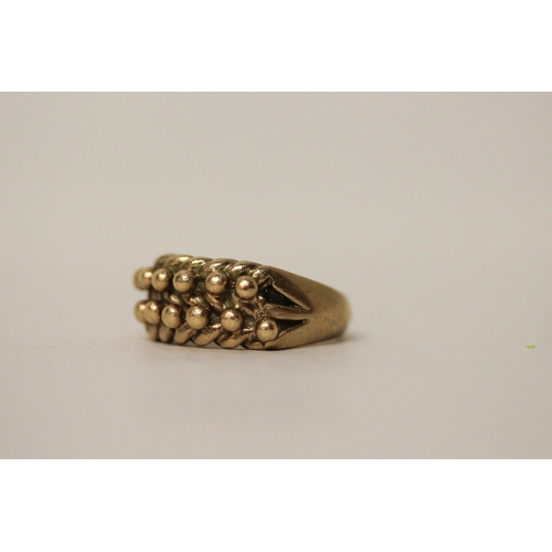 596 - A 9ct yellow gold keeper ring, hallmarked. Ring size R, gross weight 9g