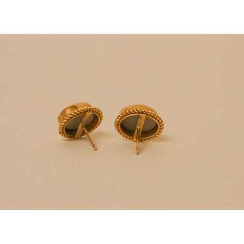 650 - A pair of oval opal ear studs, in rub over 9ct yellow gold.