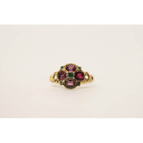 653 - An Antique 12ct gold almandine garnet and emerald cluster ring, set in a quatrefoil motif, hallmarke... 