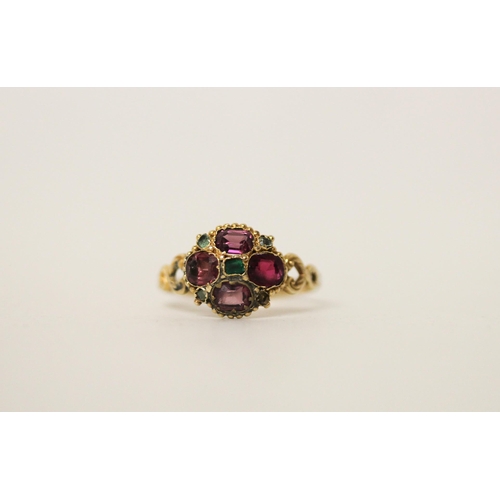 653 - An Antique 12ct gold almandine garnet and emerald cluster ring, set in a quatrefoil motif, hallmarke... 