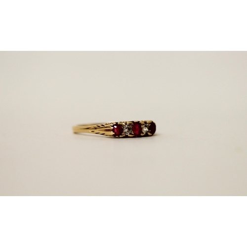 654 - An antique ruby and diamond five stone ring, with carved head, shank marked 18ct, ring size O, gross... 