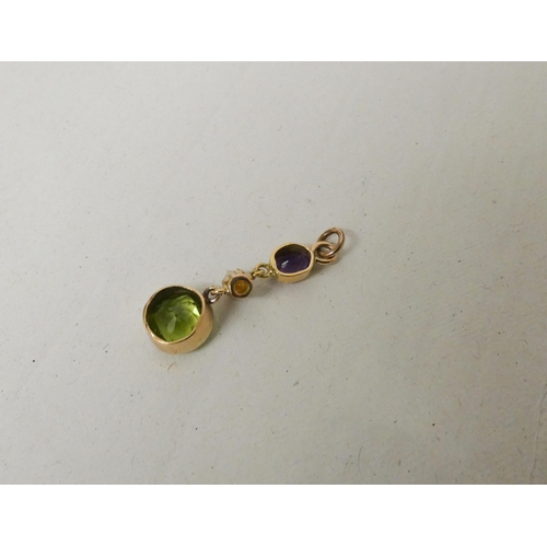 660 - An Edwardian pendant, in Suffragette colours set with pearl, peridot and amethyst.