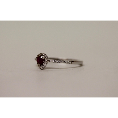 666 - A ruby and diamond modern pear shaped cluster ring, on 18ct white gold band. Ring size N. weight 1.8... 