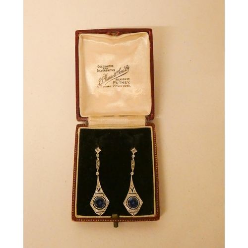 678 - A pair of Art Deco sapphire and diamond drop earrings, the articulated earrings millegrain-set with ... 