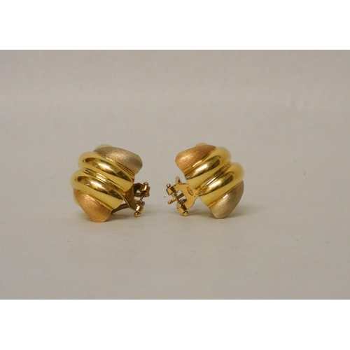 681 - A pair of modern 18ct yellow gold knot design earrings, with omega post fittings, marked 750. Gross ... 