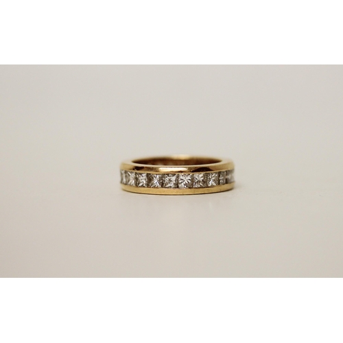 682 - A full diamond set eternity ring, princess cut diamonds channel set in good quality 18ct yellow gold... 