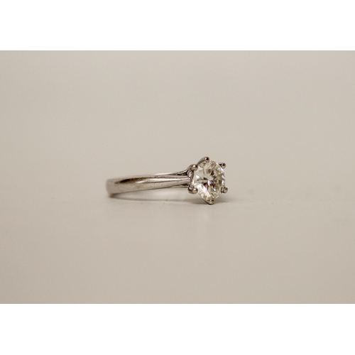 683 - A solitaire diamond ring, with a brilliant cut circular diamond weighing one carat in claw setting t... 