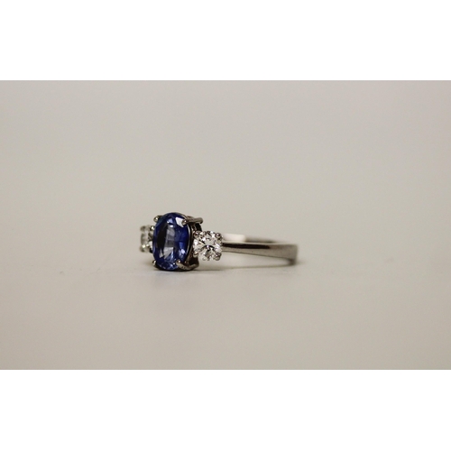 692 - A modern sapphire and diamond three stone ring, on platinum band, shank marked PT. Ring size N, gros... 