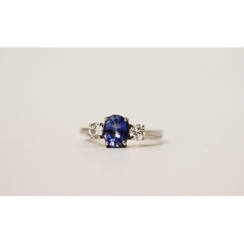 692 - A modern sapphire and diamond three stone ring, on platinum band, shank marked PT. Ring size N, gros... 