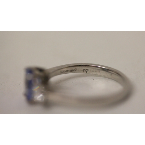 692 - A modern sapphire and diamond three stone ring, on platinum band, shank marked PT. Ring size N, gros... 