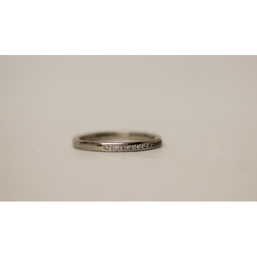 707 - A platinum half hoop diamond eternity or stacking ring. Hallmarked, ring size M, weight 3.3g