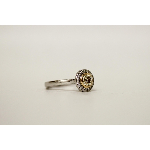 708 - A modern circular yellow diamond cluster ring, on hallmarked platinum shank. With a copy of GIA cert... 