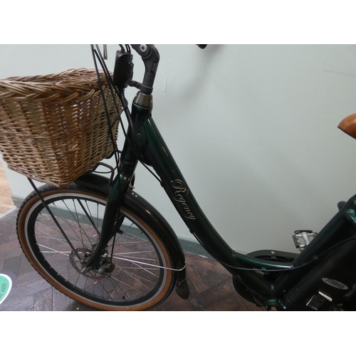 781 - A Regency green vintage style electric bicycle, with rear rack, front basket, mud guards and other v... 