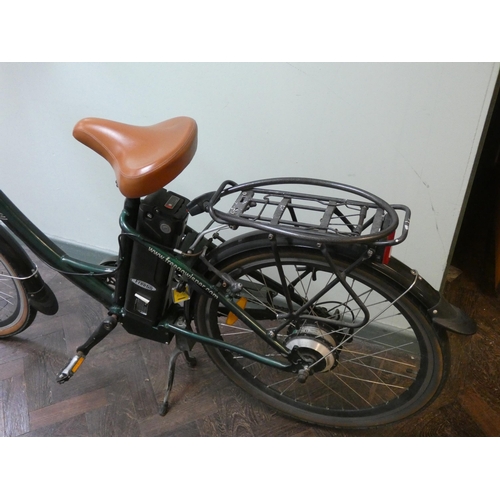 781 - A Regency green vintage style electric bicycle, with rear rack, front basket, mud guards and other v... 