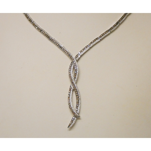 732 - A modern cognac and white diamond set necklace, all set in 14k white gold. Marked on clasp. Gross we... 