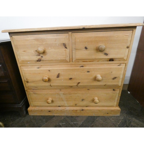 10 - A Victorian style stripped pine chest of two long and two short drawers with bun handles. 3' wide