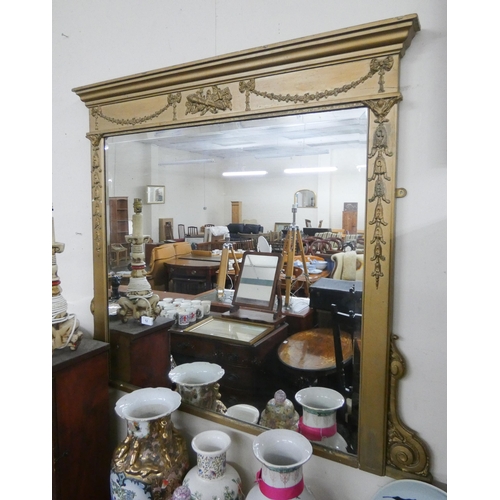 12 - A Victorian bevelled wall mirror in decorative embossed gilt frame. 3' square