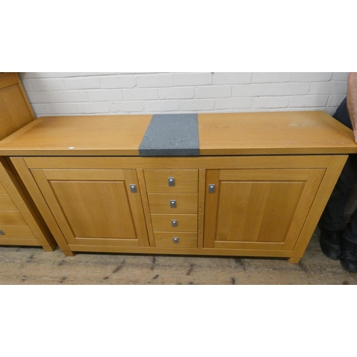 181 - A modern chunky light-oak sideboard fitted cupboards and four centre drawers with inset tile in the ... 