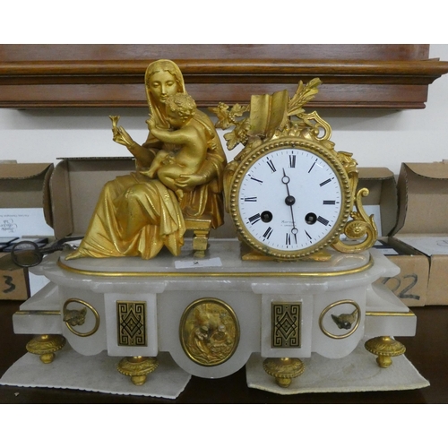 2 - A French gilt striking mantel clock with lady and child figure mount on a white alabaster base