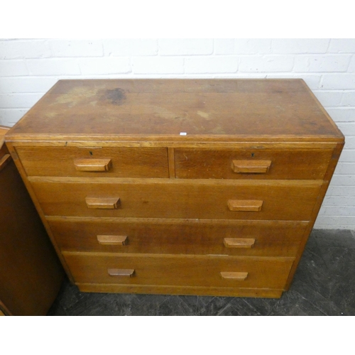 214 - A 1950's oak chest of three long and two short drawers. 3'6