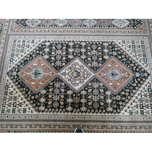 230 - A Persian designed figured Wilton carpet. 10' x 6'6