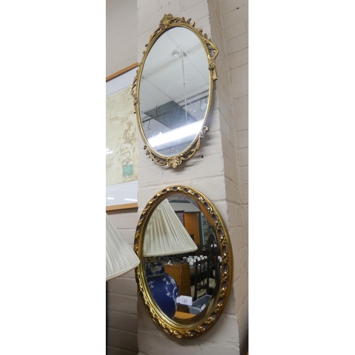 33 - Two oval wall mirrors in gilt frames