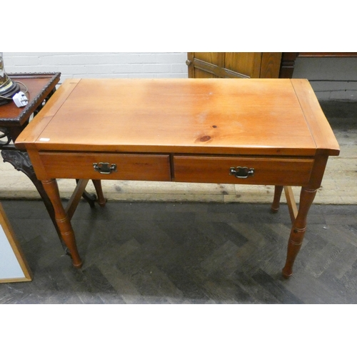 42 - A cherry wood hall table fitted two drawers on turned legs. 3'6