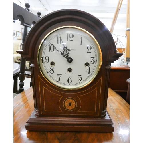 59 - An Edwardian inlaid mahogany Westminster chiming bracket clock signed on the face, Howard Miller.