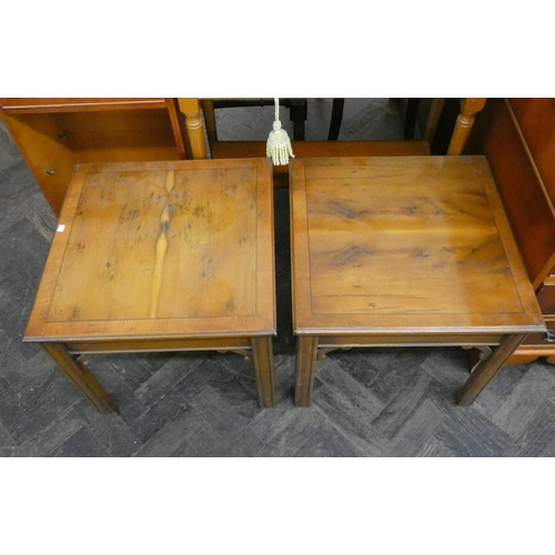 70 - A pair of square yew wood cross banded coffee tables and a two tier hall table fitted two drawers