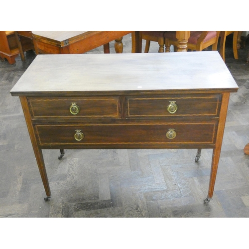 81 - A low Edwardian inlaid mahogany chest of one long and two short drawers 3'6