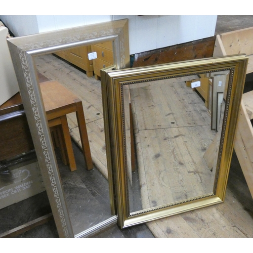 98 - A bevelled wall mirror in gilt frame and a long gilt framed mirror