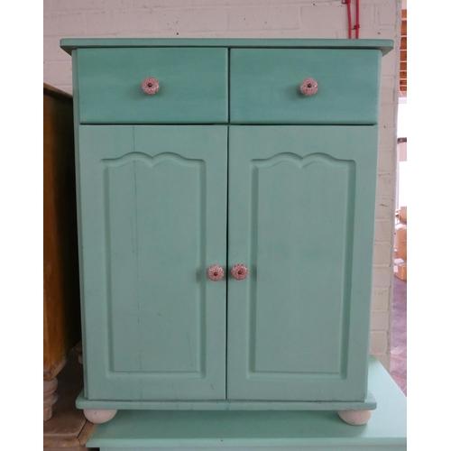 246 - A pale green painted chest of three long and two short drawers with bun handles and a similar cupboa... 