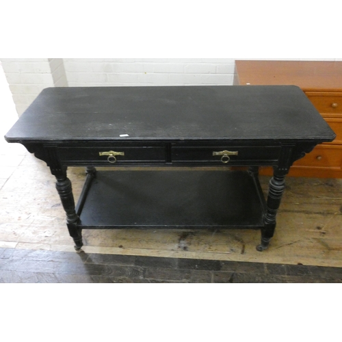 262 - An Edwardian two tier black oak hall table, fitted two drawers. 4'6